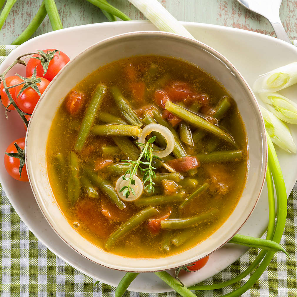 soup with green beans onions and tomatoes, vegetarian food