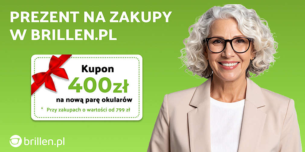 Uśmiechnięta Pani o siwych włosach, w okularach, w beżowej marynarce.