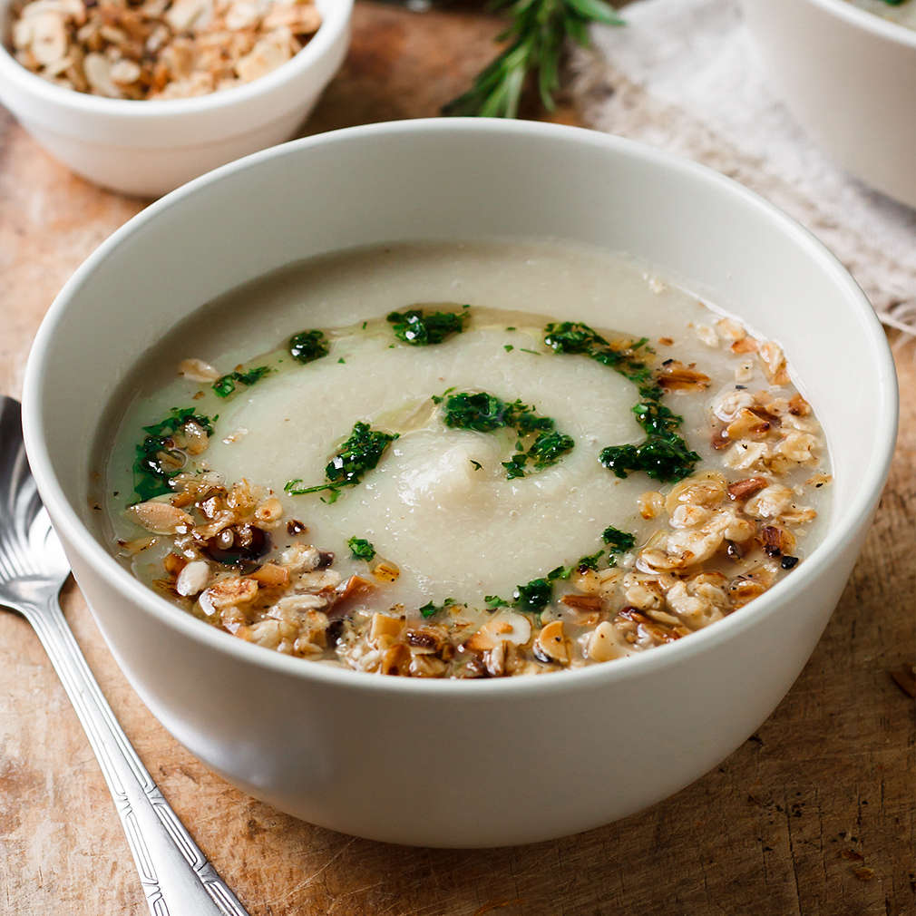 Celery cream soup with green oil and granola