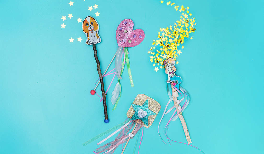 Kind bastelt Spielstäbe