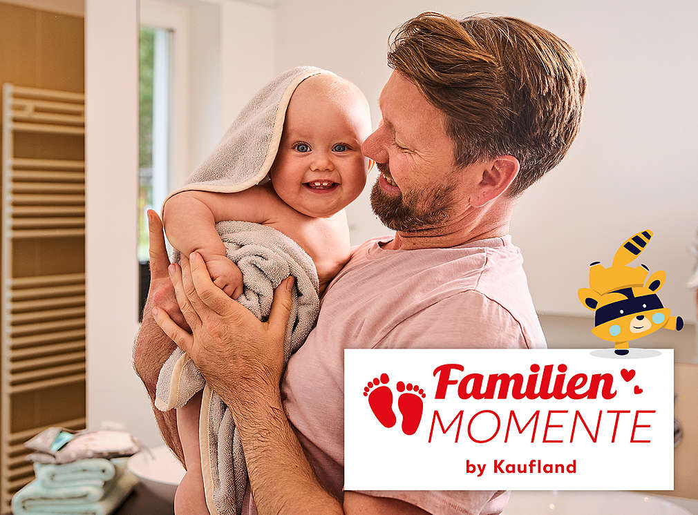 Vater mit Kind auf dem Arm