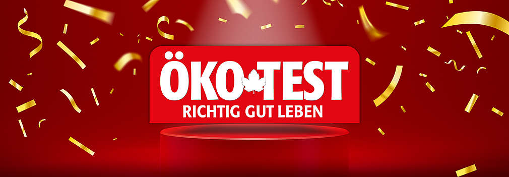 Roter Hintergrund, Podest, goldenes Konfetti, Logo: ÖKO-TEST