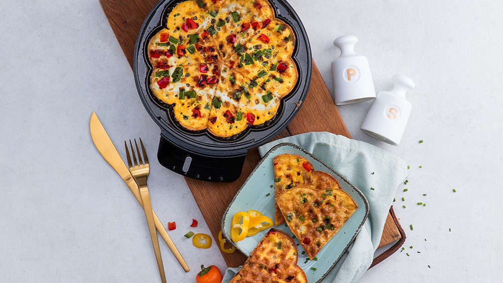 Mit Teig gefülltes Waffeleisen